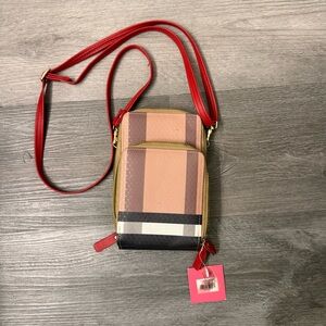 Black, Tan, and White Crossbody Bag with Red Strap